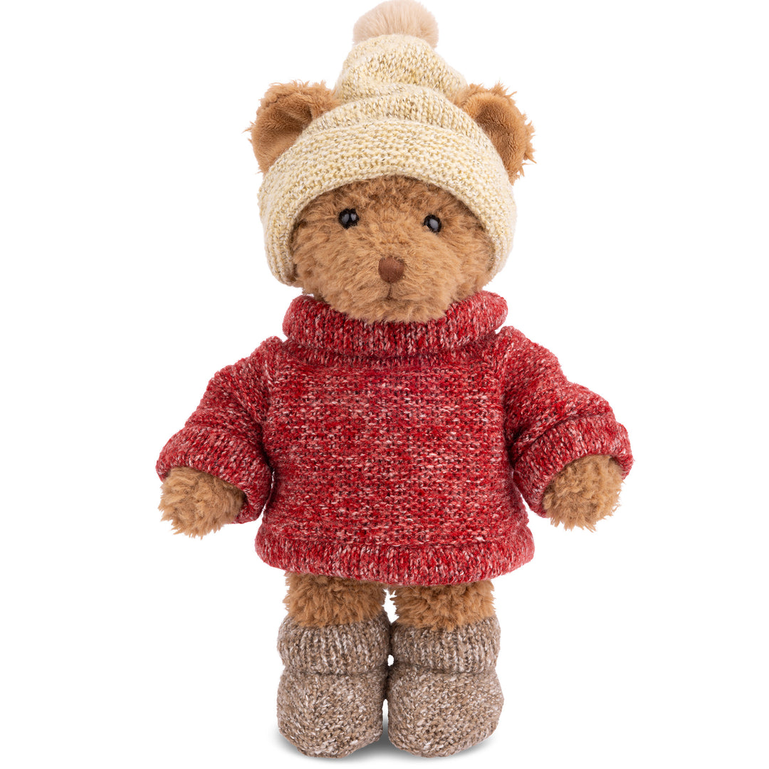 Bukowski Bears Brother Steve plush teddy bear wearing a red knitted sweater, cream pom-pom hat, and brown boots. 