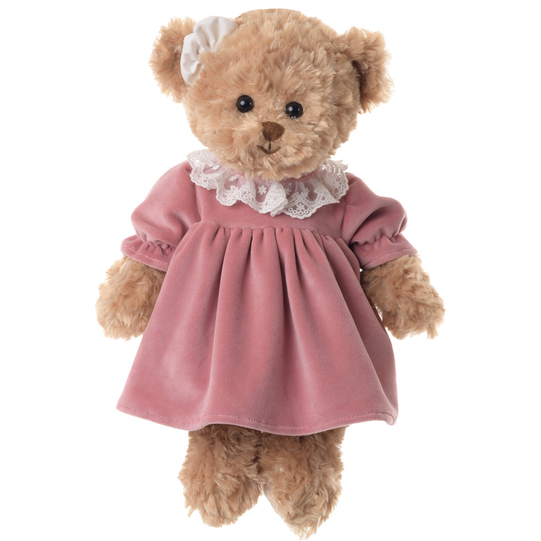 Bukowski Bears Sophia plush teddy bear wearing a pink dress with a white lace collar and matching bow on her head
