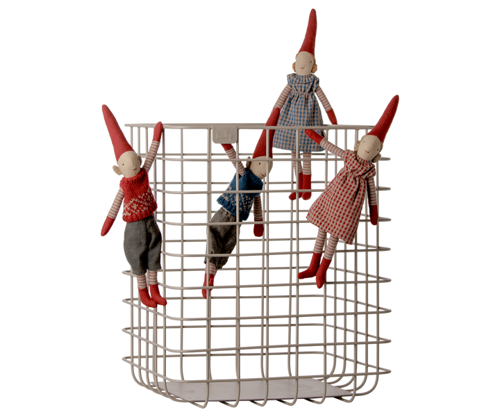 Maileg Christmas pixy elves displayed together in a wire basket, featuring traditional Scandinavian holiday outfits