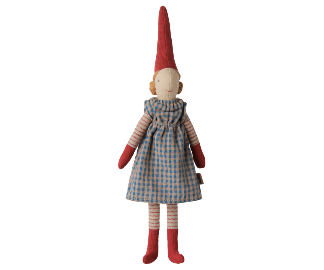 Maileg Christmas Pixy girl doll wearing a blue checkered dress, striped stockings, red mittens, and a tall red hat. 