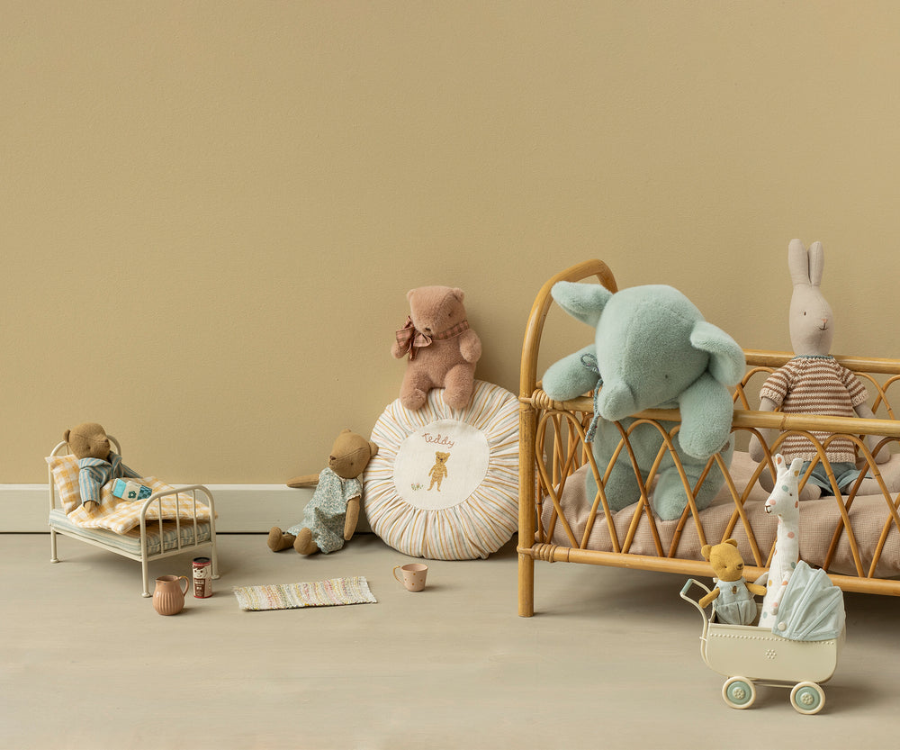 A styled Maileg scene featuring medium plush elephant in soft mint color