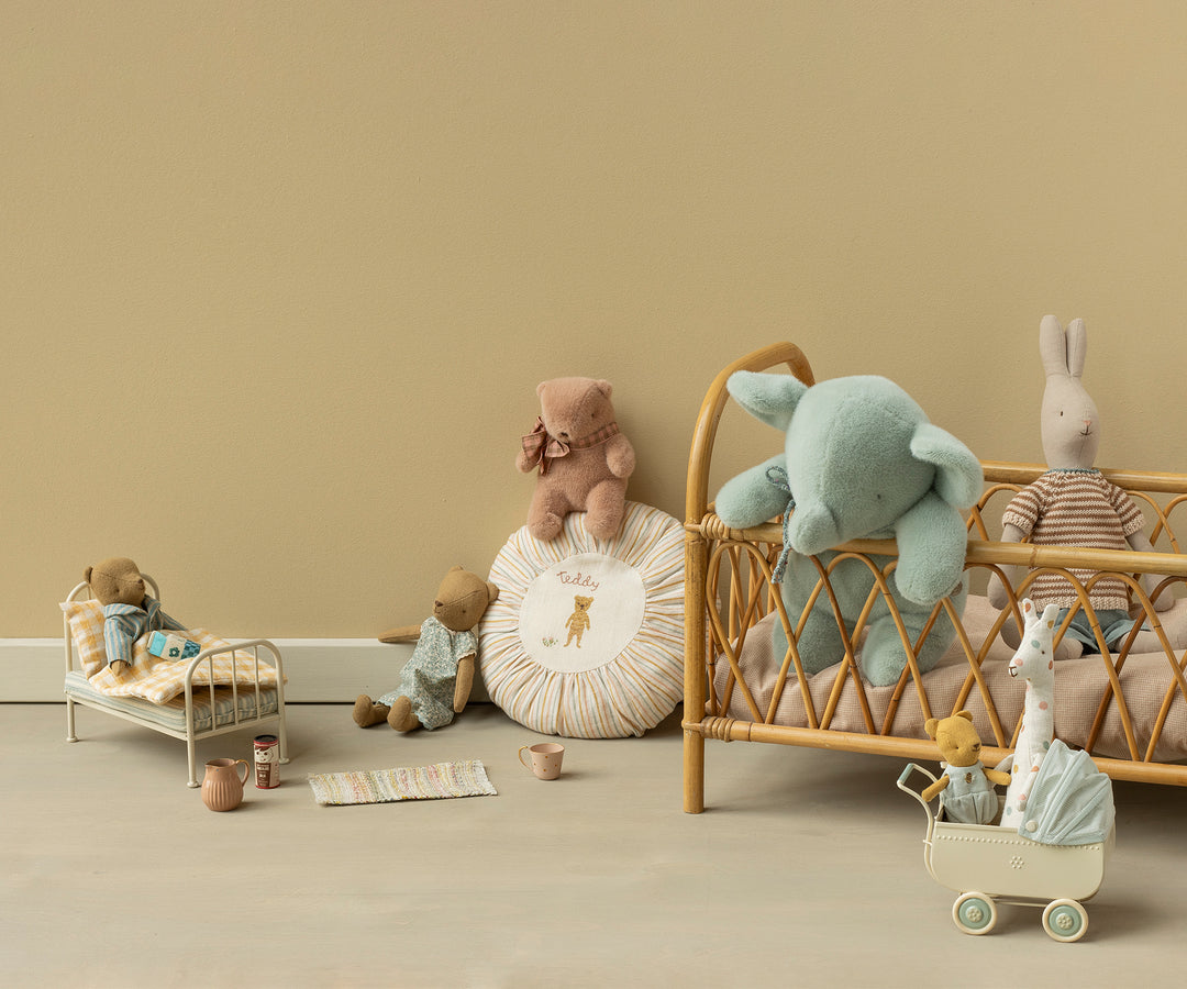 A styled Maileg scene featuring medium plush elephant in soft mint color