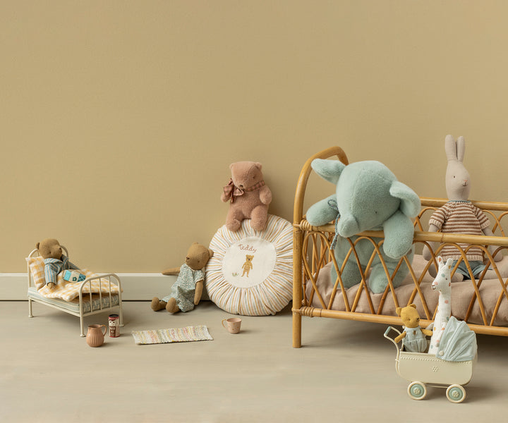 A styled Maileg scene featuring medium plush elephant in soft mint color
