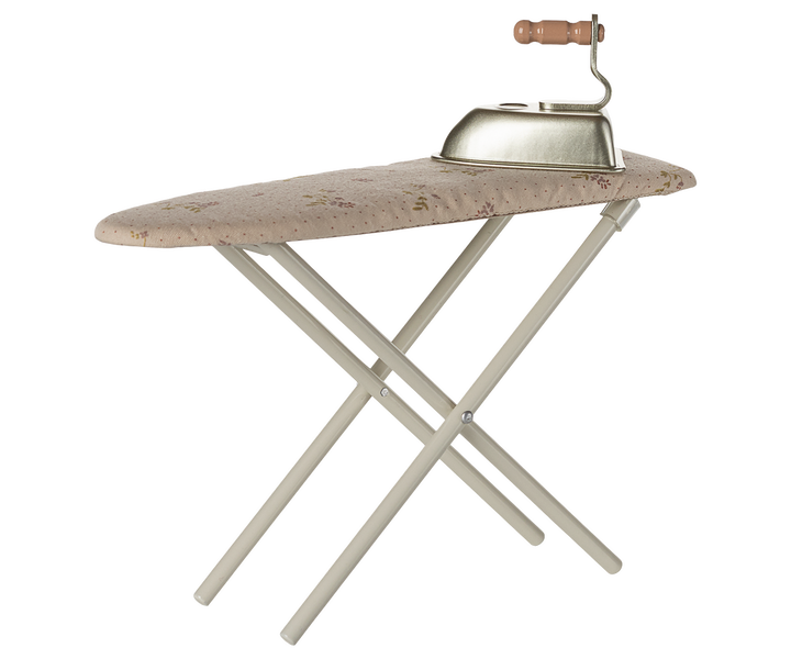 Maileg miniature iron and folding ironing board with off-white floral fabric cover for dollhouse play.
