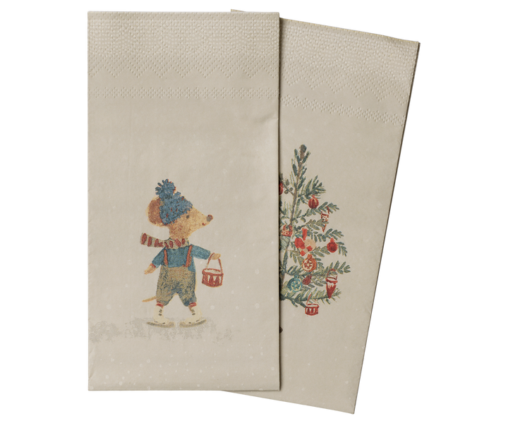 Two beige Maileg paper napkins with a vintage holiday illustration, featuring a mouse in winter clothing and a decorated Christmas tree.