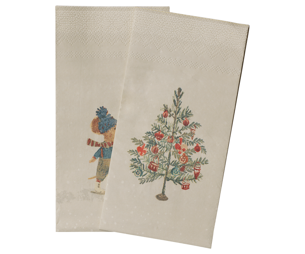 Two beige Maileg paper napkins with a vintage holiday illustration, featuring a mouse in winter clothing and a decorated Christmas tree.