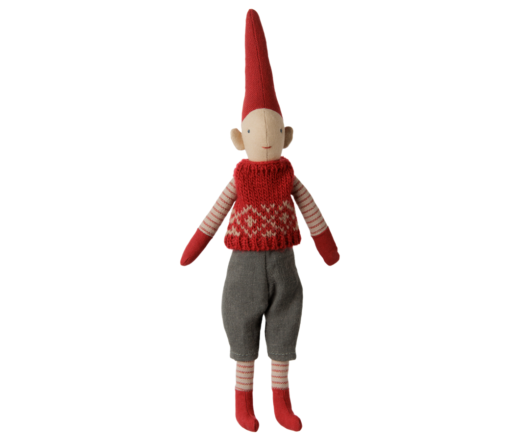 Maileg Christmas Pixy boy wearing a red knitted vest, gray pants, striped stockings, and a tall red hat. 