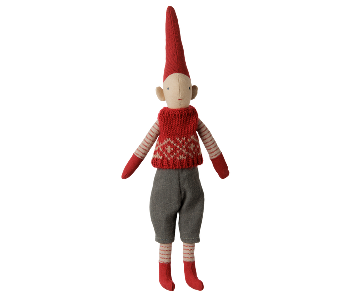 Maileg Christmas Pixy boy wearing a red knitted vest, gray pants, striped stockings, and a tall red hat. 