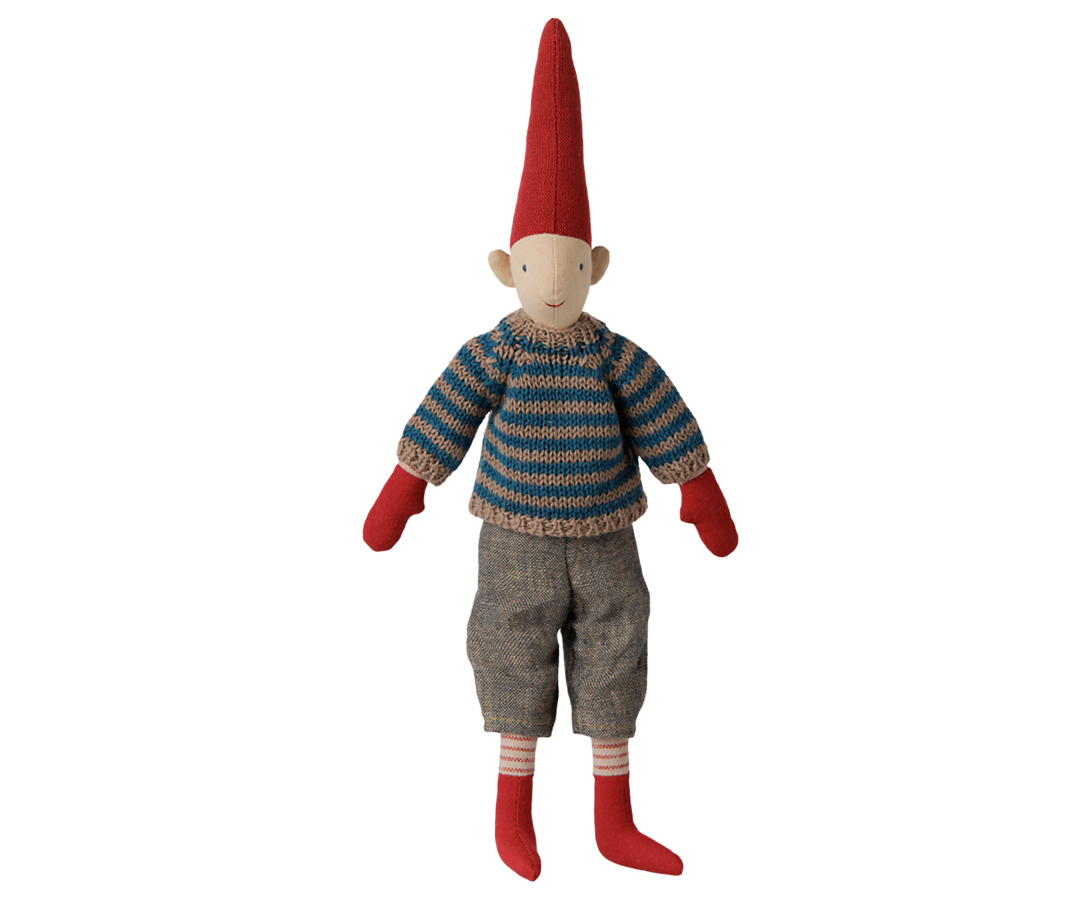 Maileg Pixy Size 2 boy wearing a blue striped knitted sweater, gray pants, red mittens, and a tall red Christmas hat. 
