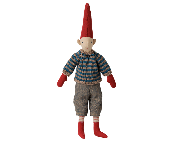 Maileg Pixy Size 2 boy wearing a blue striped knitted sweater, gray pants, red mittens, and a tall red Christmas hat. 