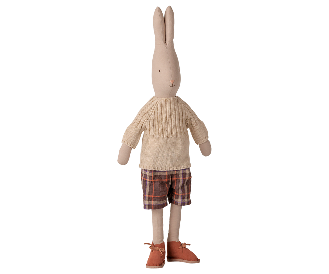 Maileg Size 4 classic rabbit doll wearing a cream knitted sweater, plaid shorts, and brown lace-up shoes. 