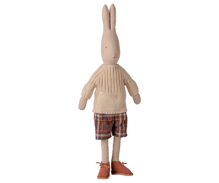 Maileg Size 4 classic rabbit doll wearing a cream knitted sweater, plaid shorts, and brown lace-up shoes. 